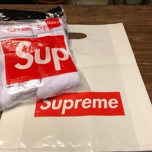 Supreme Hanes crew socks men’s pack of 4 size 6-12 includes a Supreme bag.